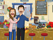 Load image into Gallery viewer, Bobs burgers family picture with man wearing glasses, holding a knife, woman wearing silver hoops and cats sitting on the counter with christmas decorations inside the restaurant.