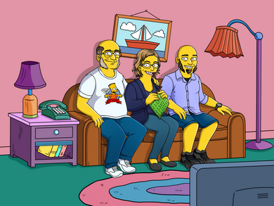 The Simpsons family portrait a couple and their son sitting on a couch, man is wearing glasses and a bart simpsons shirt and woman is sewing something.